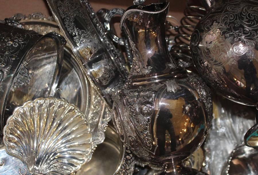 A small collection of silverware, to include; two silver napkin rings, a silver handled magnifying