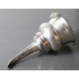 A George IV silver two piece wine funnel, maker's mark "TC", assayed London 1822, of traditional