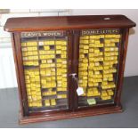 An early 20th century Cash's Woven Double Letters mahogany shop display cabinet, with twin glazed