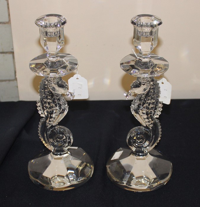 A pair of Waterford crystal "Seahorse" candlesticks, with seahorse columns, etched "Waterford" to