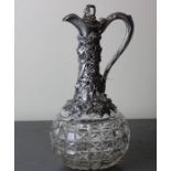 A Victorian silver mounted cut glass claret jug, by Horace Woodward, assayed Birmingham 1873, having