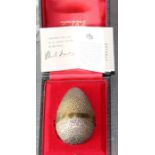 A cased limited edition Stuart Devlin "surprise" silver gilt Easter egg, assayed London 1969, the
