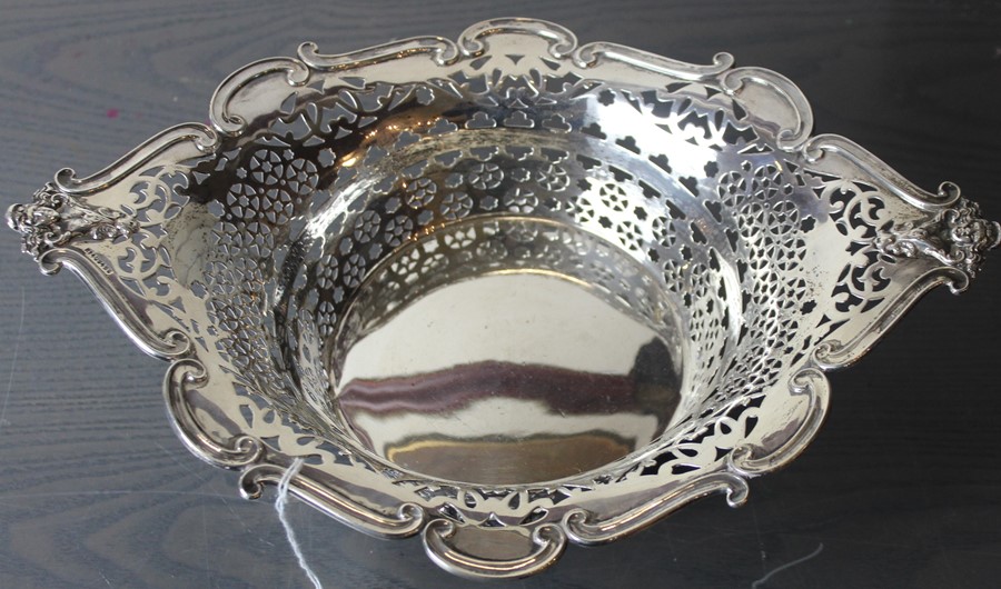 A silver table basket, by William Aitken, assayed Birmingham 1904, of pierced navette form, with