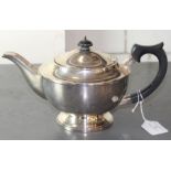 A silver teapot, by Elkington & Co Ltd, assayed Birmingham 1936, finial lacking retaining nut. (