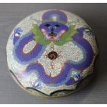 An early  20th century Chinese cloisonne circular box depicting a dragon.