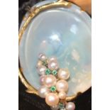 An 18ct. gold, iridescent shell, emerald and pearl pendant, the transluscent mollusc shell with