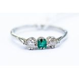 An emerald and diamond three stone platinum ring, size M, total gross weight approx 2.4gms