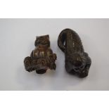 A Japanese dark wood Netsuke depicting an owl sat on a thick branch or log, superb patina, in