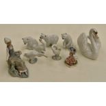 A collection of nine Lladro figures to include swans, bears, geese, Kingfisher and a maiden