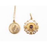 A 19th century circular mourning pendant, unmarked assessed as approx 15ct, on a later 9ct gold