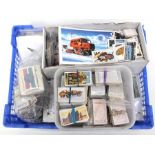 A large collection of cigarette cards with twelve sets of cigarette cards and twelve sets of