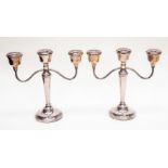 **REOFFER IN A&C NOV £180-£200** A pair of Birmingham silver candelabras, filled, 1978, maker A.T