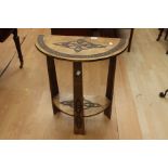 Demi Lune console table with decorative carving.