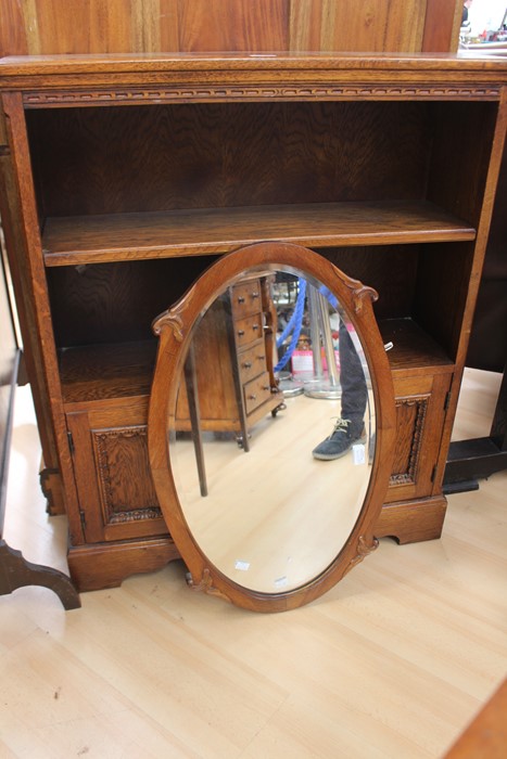 A traditional oak bookcase with a cupboard below, together with an oval mirror - Image 4 of 4