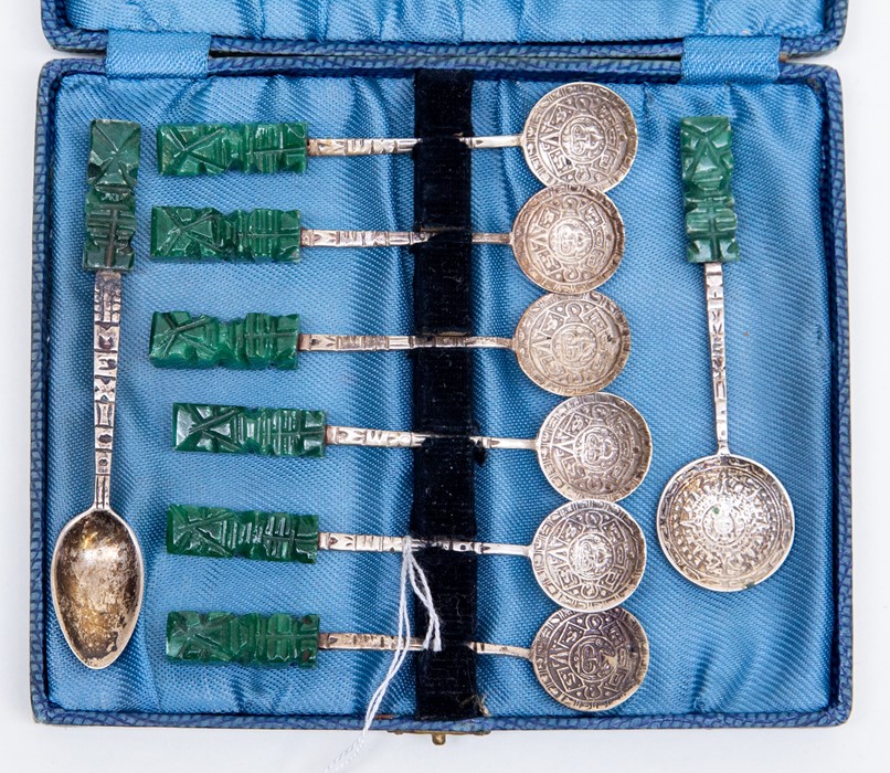 A boxed set of Mexican silver coffee spoons, 925 together with two additional spoons, finials are