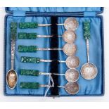 A boxed set of Mexican silver coffee spoons, 925 together with two additional spoons, finials are