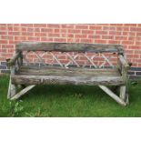 ***AWAY*** A 20th Century oak three seater garden bench.