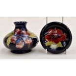 A Moorcroft tray along with a Moorcroft vase in the Hibiscus design