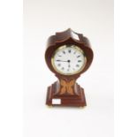 An Edwardian style inlaid mahogany mantle clock, white enamel dial and Roman numerals, on brass