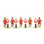 A group of Britains toy lead soldiers and Beefeaters