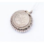 A late 18th Century pendant (no internal effects) each side with silver coin with Latin inscription
