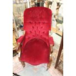 **AWAY** A Victorian red velvet , button backed ladies chair with ceramic castors.