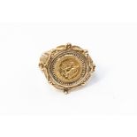 A Pesos set in a fancy 9ct gold ring mount, size L, total gross weight approx. 8.4gms