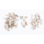 A quantity of silver charms, including transport, churches, prams, keys, money, total gross weight