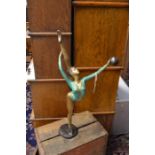 An Art Deco style female figure in painted brass, approx 57 cms in height
