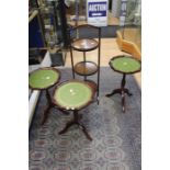 An Edwardian mahogany three tier cake stand; three similar leather inlay wine tables (4)