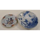 **AWAY MERGE** An 18th Century porcelain plate decorated in an Oriental style with cobalt blue and