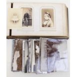 Victorian album of cabinet cards, approximately 50 photographic portraits by various studios