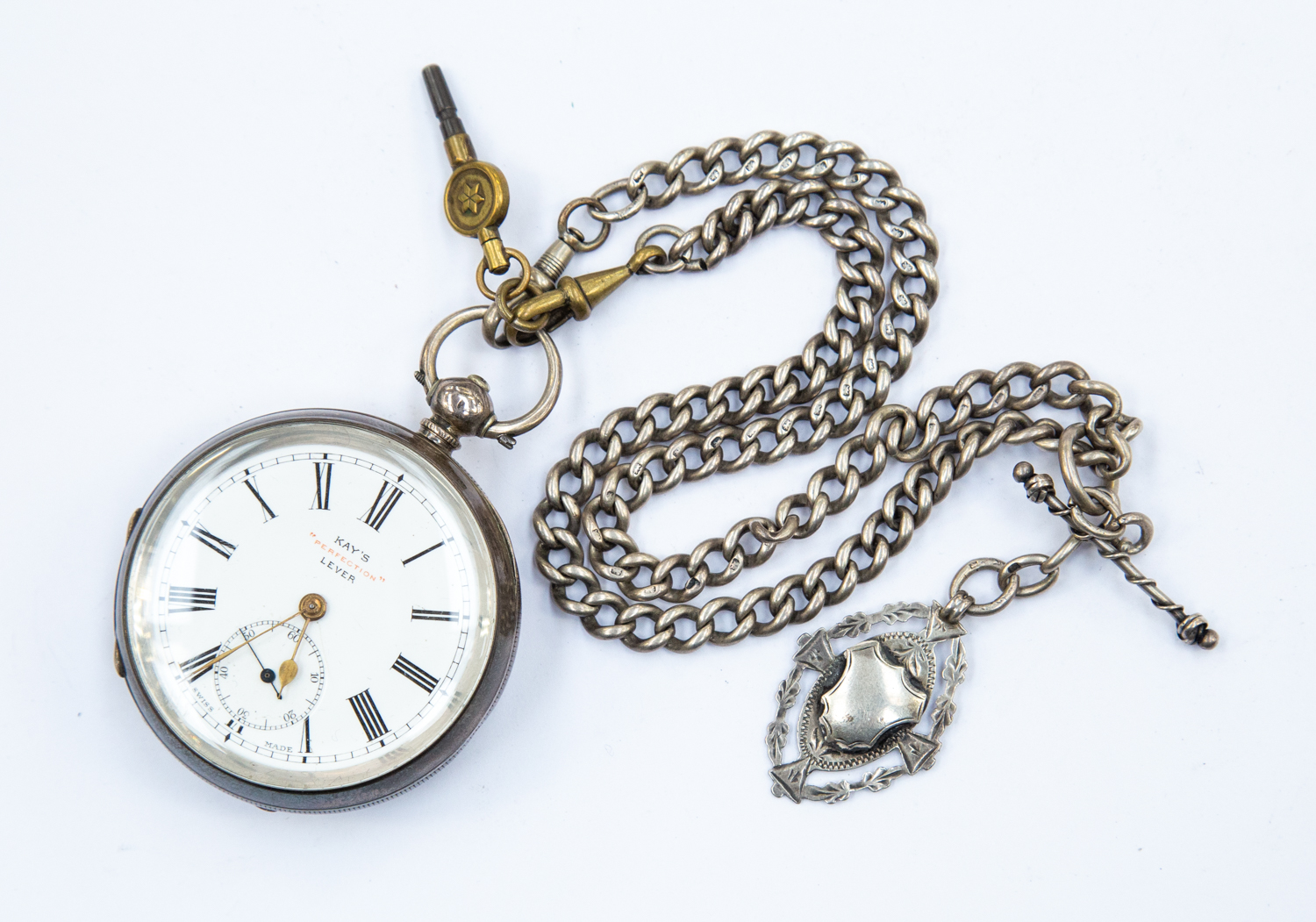 A late 19th Century gents pocket watch, chain, medallion and key, KAY's Perfection lever