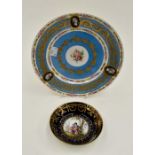 Continental plate with blue ground and gilt detail along with a smaller plate with courting couple