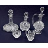 A Waterford cut glass pedestal claret jug, with Hobnail cutting to body, two cut glass decanters,