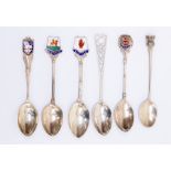 Six assorted silver teaspoons, including enamelled souvenir spoons, 'Ulster', 'Sark', 'Freshwater'