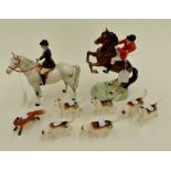 Beswick; huntsman mounted, together with lady in bowler, mounted on a grey horse, six hounds and a