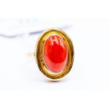 **REOFFER IN A&C NOV £120-£140** A coral set dress ring, set with an oval coral, size approx. 15mm