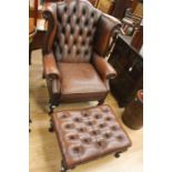 A wingback armchair with footstool