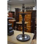 A pair of early 20th Century mahogany candlesticks