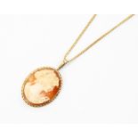 A 9ct gold cameo pendant, rose edge surround with gold bail, size approx 20mm x 35mm, on a 9ct