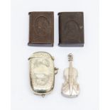A white metal vesta case modelled as a violin, together with an EPNS vesta case with section as a