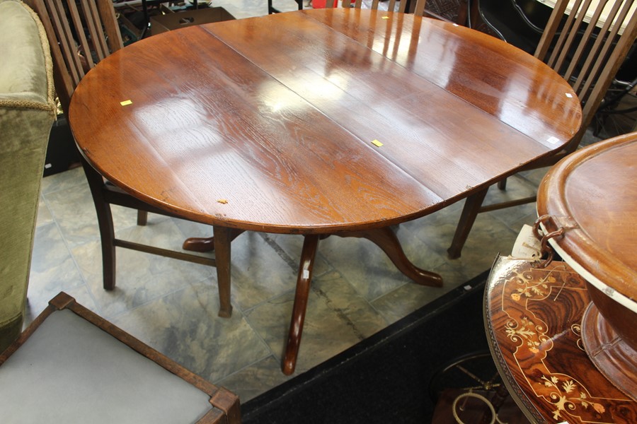 Oak extending pedestal table with leaf,