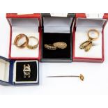 A collection of size 9ct gold rings, comprising two granular design rings, a plain band with a