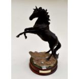 **REOFFER IN A&C NOV £130-£150** A Royal Doulton horse "Lloyds Black Horse", on stand