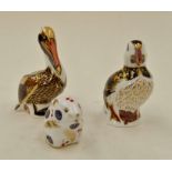 Royal Crown Derby paperweights of a puffin, pelican and a field mouse with silver stoppers