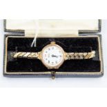 A 1930's ladies  9ct gold watch by Whytocks, enamel dial, numbers, on later plated expander strap,
