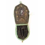 **REOFFER IN A&C NOV £70-£120** An 18th century Tibetan Phua copper gilt metal mihrab shaped