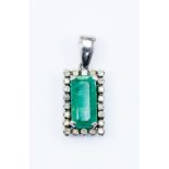 An emerald and diamond pendant, the rectangular emerald measuring approx. 14mm x 6mm, with a diamond