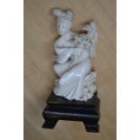Japanese ivory figure of a Geisha on wooden stand approx 10 cms high